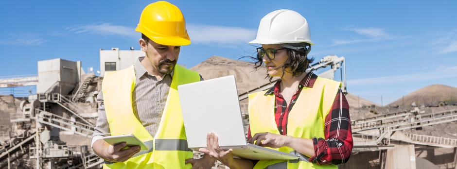 A digital safety consultant using web-based forms on a laptop, streamlining compliance with Wombat Safety Software.