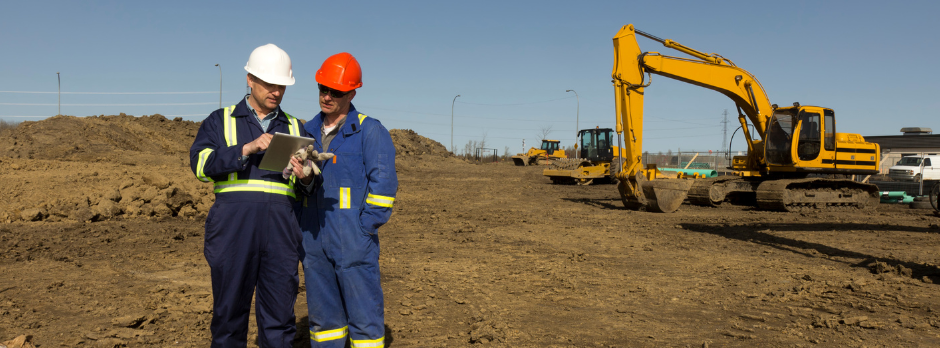 A safety specialist reviewing workplace safety manuals and conducting a safety audit to ensure compliance and a safe environment for employees