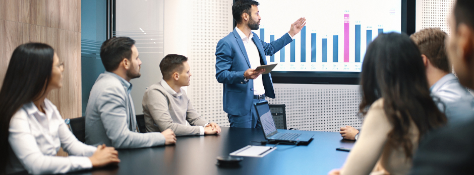Illustration of a digital dashboard showing real-time adoption metrics, with team members collaborating and receiving in-app guidance from AI-powered change management tools after Wombat Safety Software go-live